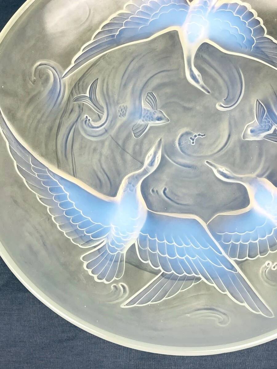 Verlys, iridescent glass cut with a design of geese and fish.