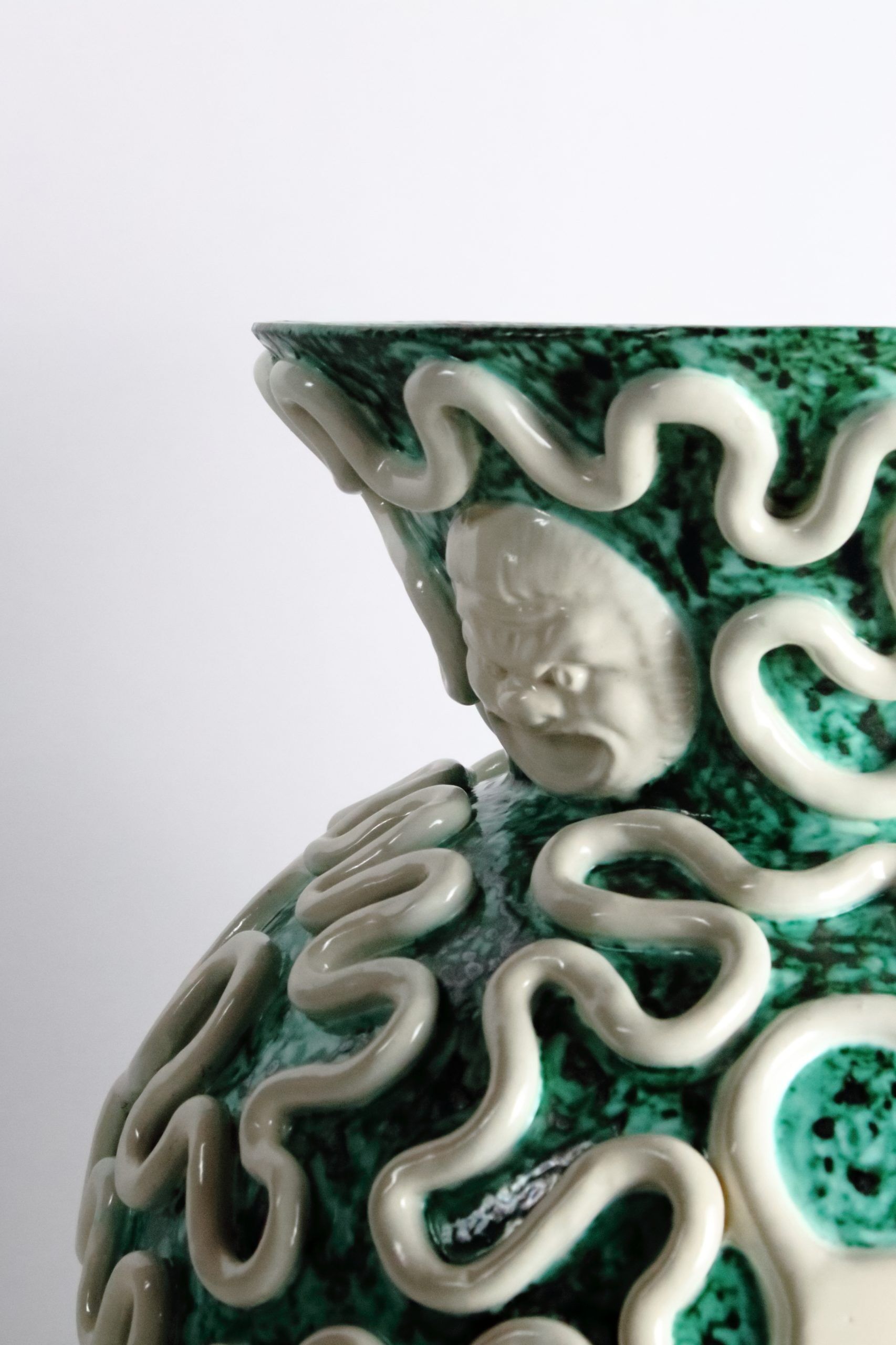 Manufacture Sainte-Radegonde, vase pansu aux mascarons en céramique émaillée