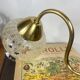 Pair of antique wall sconces in brass with tulip-shaped glass shades.