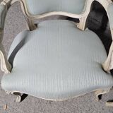 Pair of Louis XV style armchairs in patinated wood, light blue fabric.