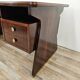 Art Deco executive desk in exotic wood, glass, and brass.