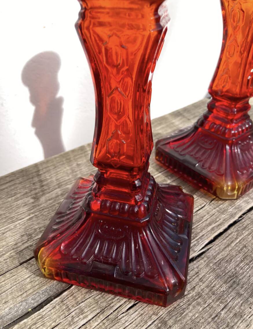 Pair of amber glass candlesticks