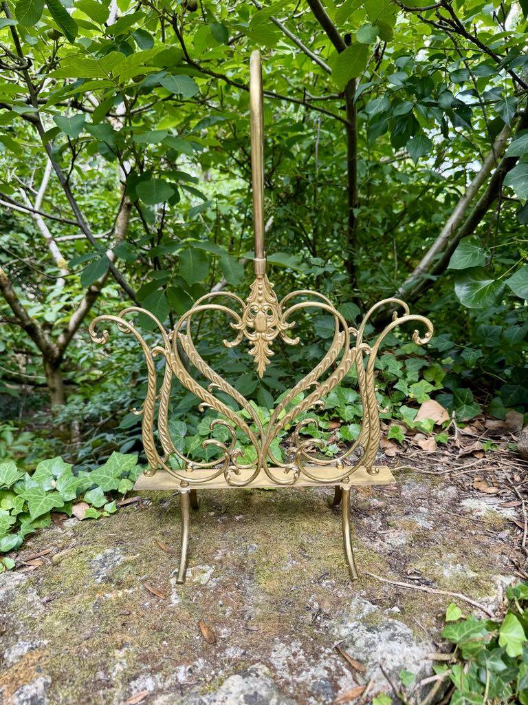 Brass magazine rack in baroque style