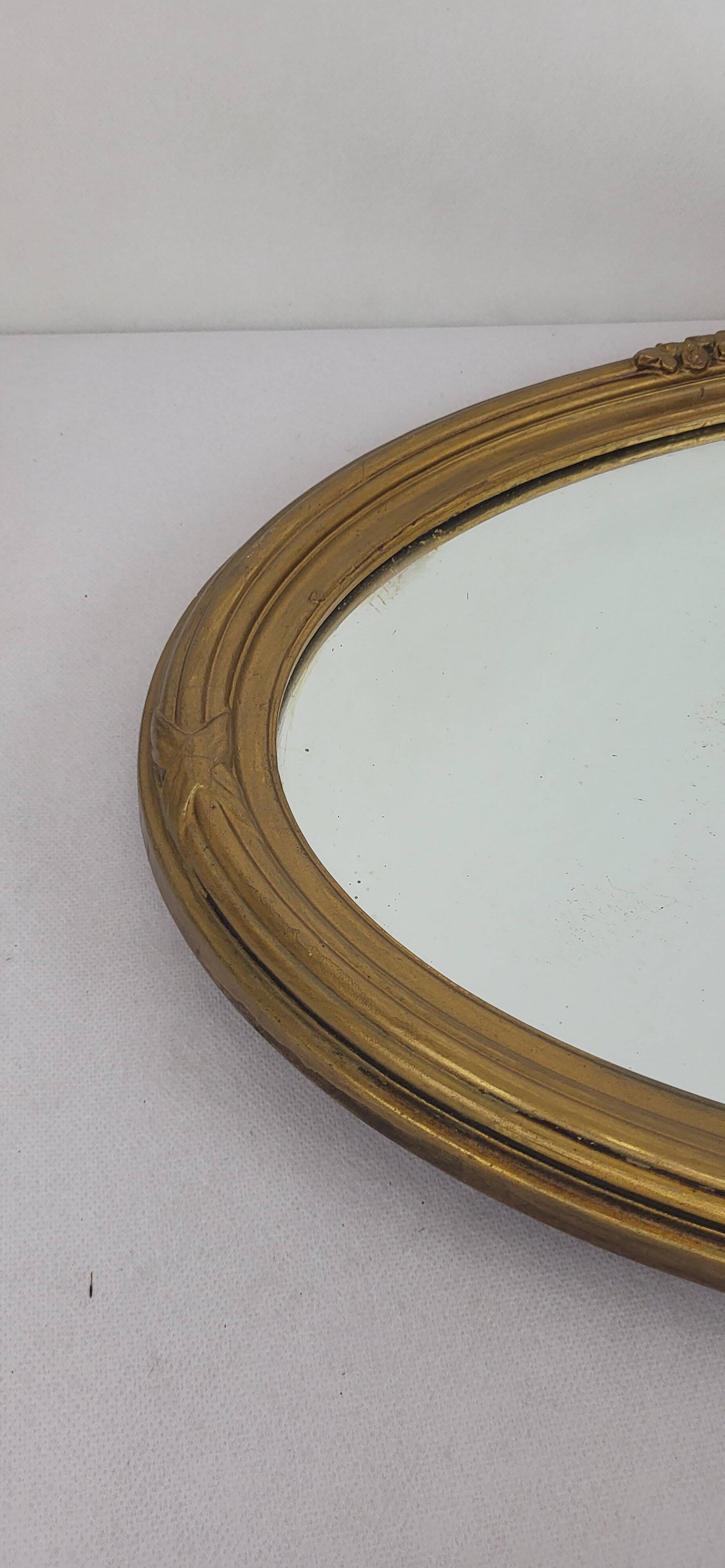 Miroir ovale en bois doré, style Louis XVI