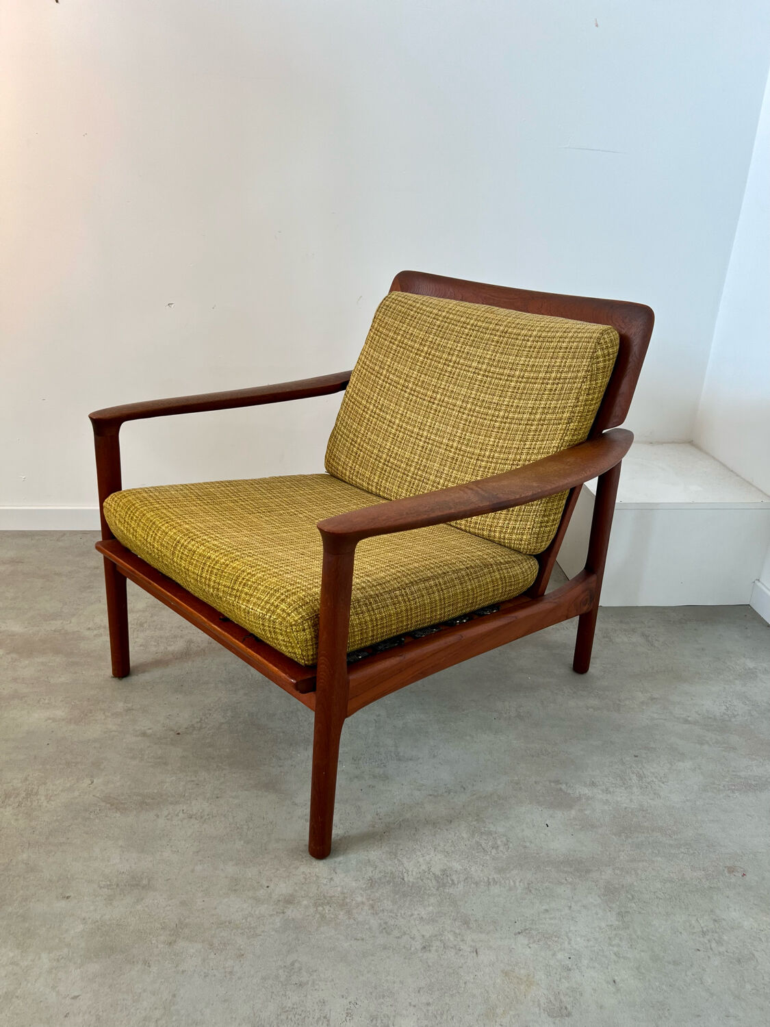 Old Scandinavian design armchair in vintage teak year 60