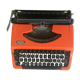 Machine à écrire orange et noire Brother 210