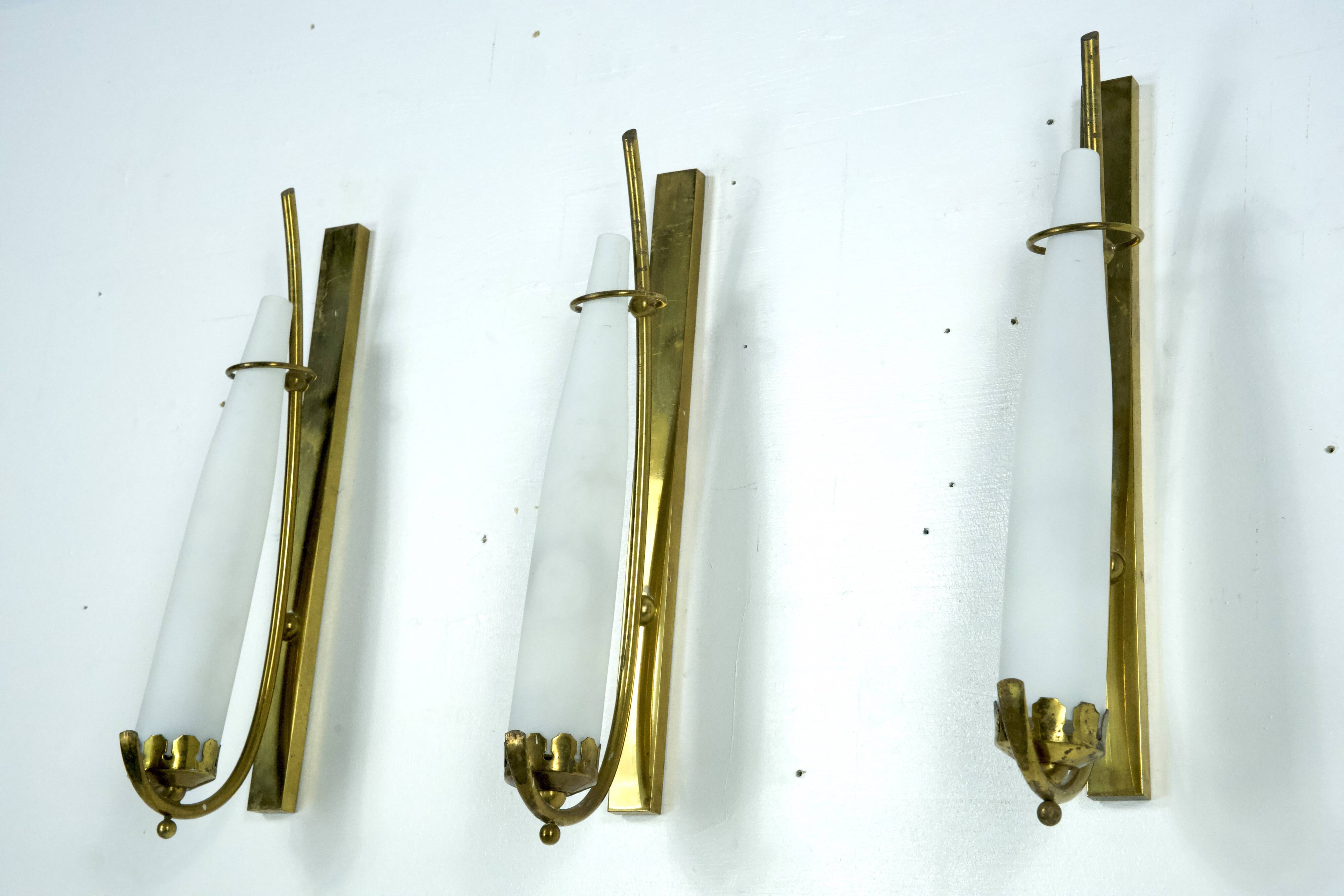 Set of three sconces in brass and triplex opaline glass. Italy 1950s