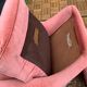 Pair of pink tufted velvet frog chairs from the 1970s.