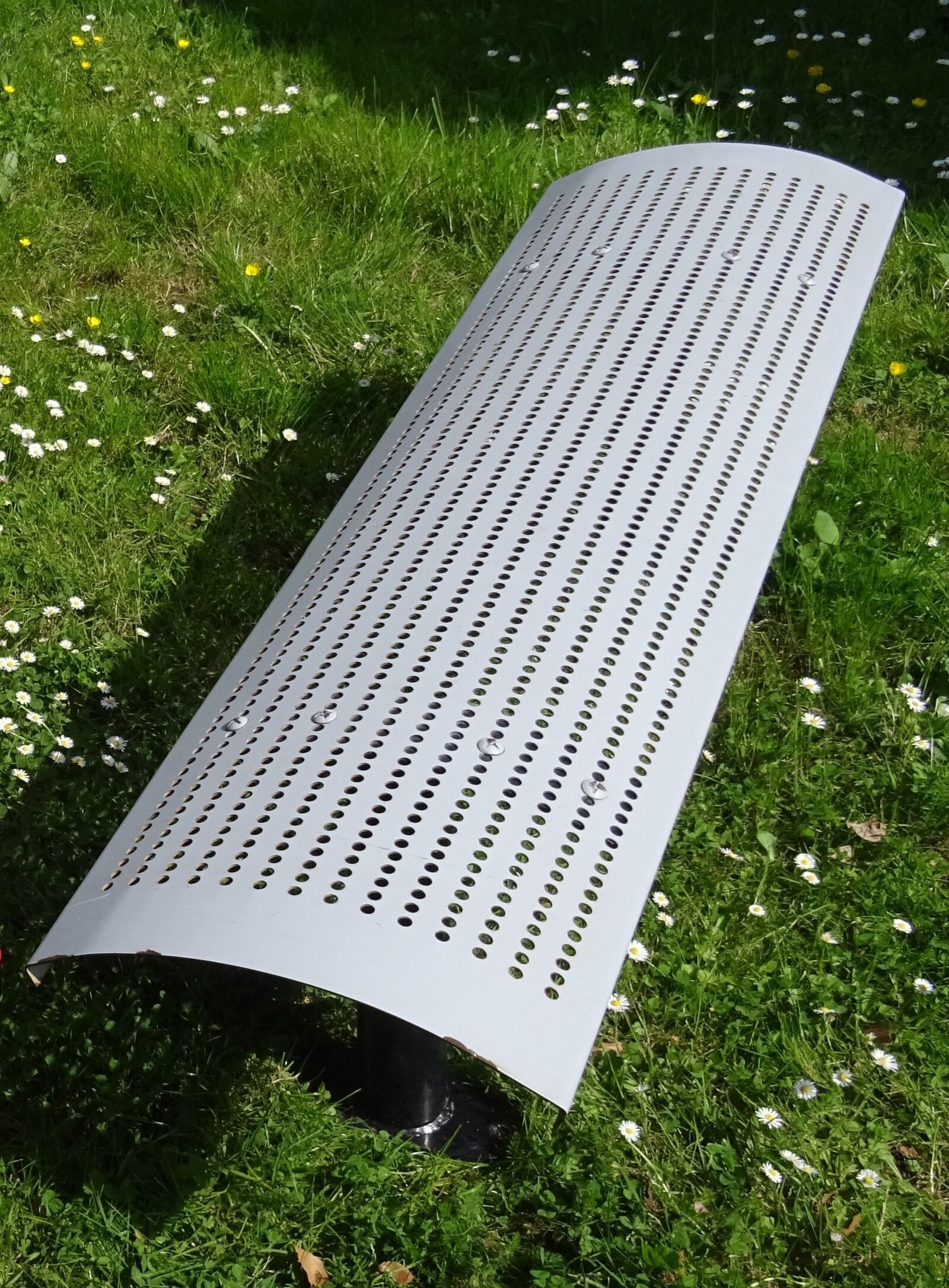 Perforated metal bench