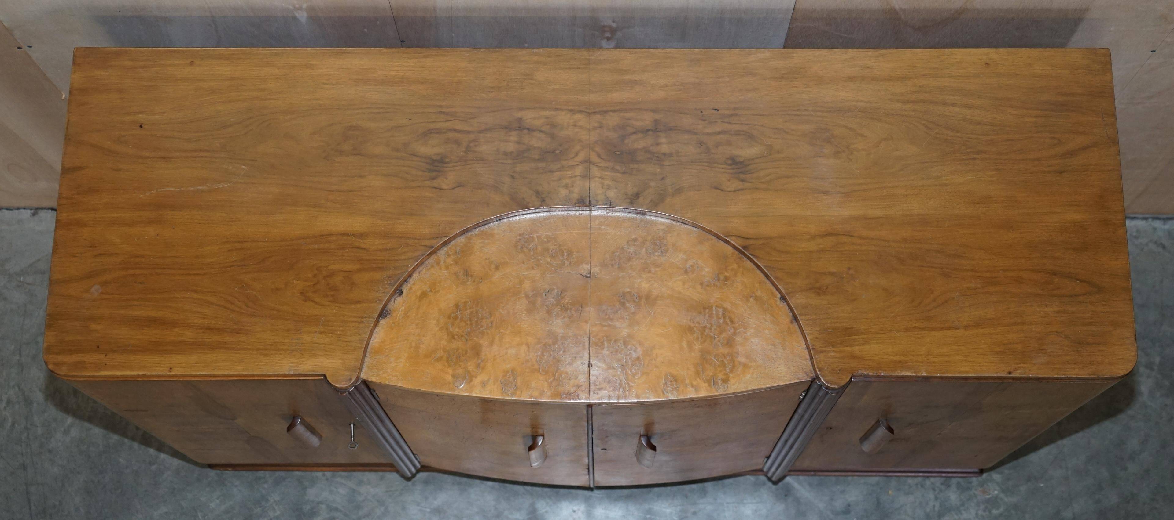 Art Deco walnut burr sideboard with drawers and bar.