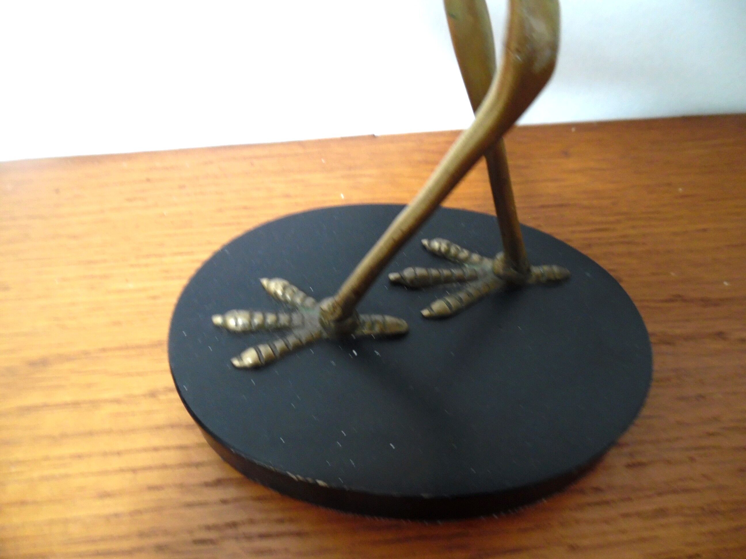 Brass heron standing