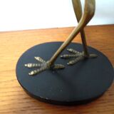 Brass heron standing