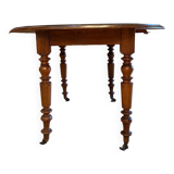 Oval drop-leaf table
