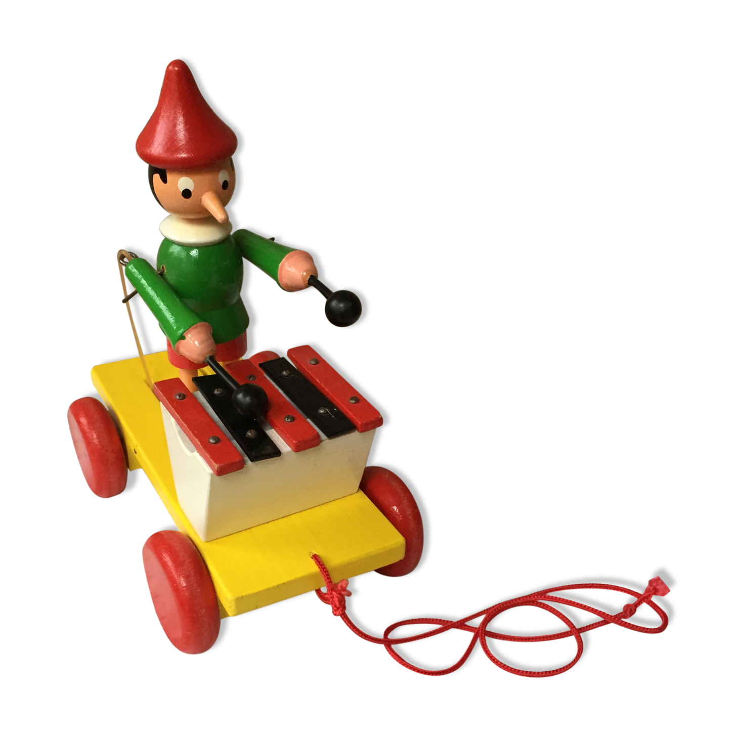 Old toy to pull Pinocchio and his xylophone