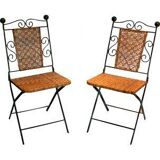 Paire de chaises pliables en fer forgé et rotin.