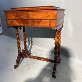 Antique wooden sewing table with drawer.