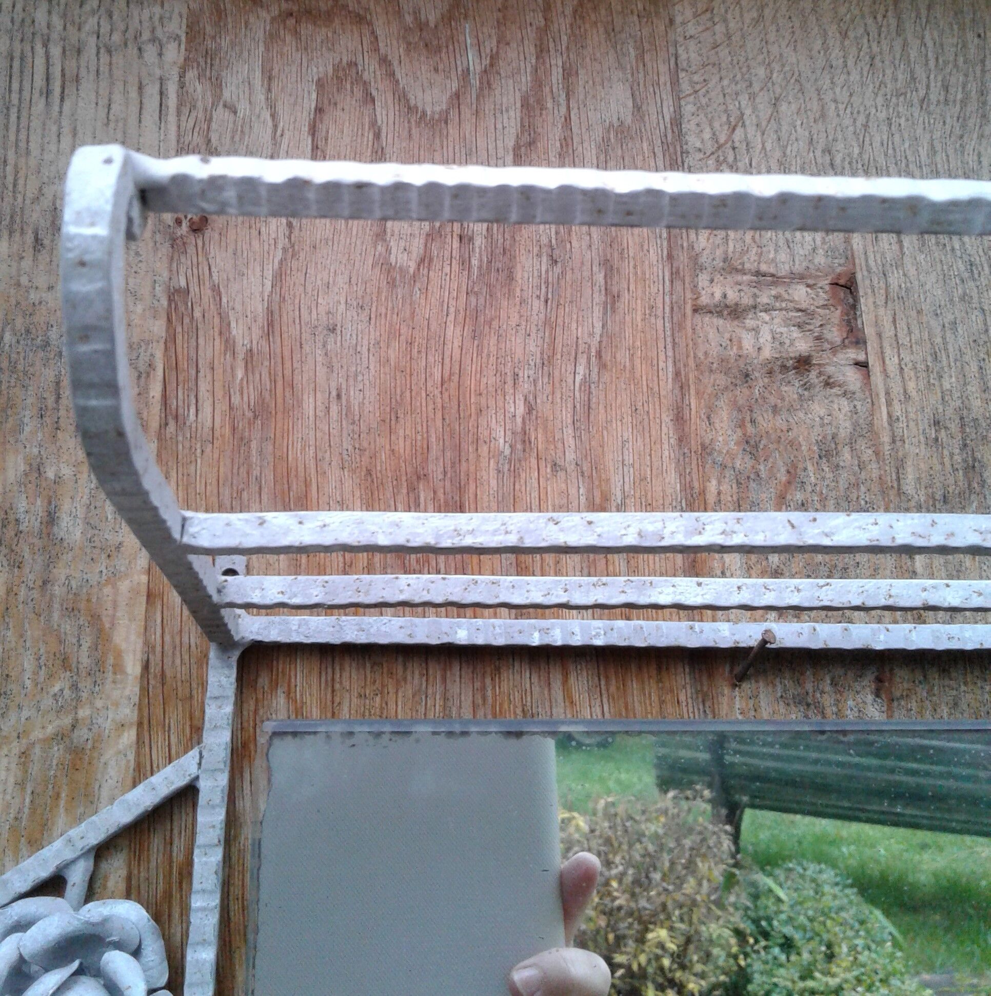 Former Wall coat hangers painted in gray iron