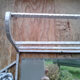 Former Wall coat hangers painted in gray iron