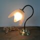 Table lamp with glass globe and brass foot