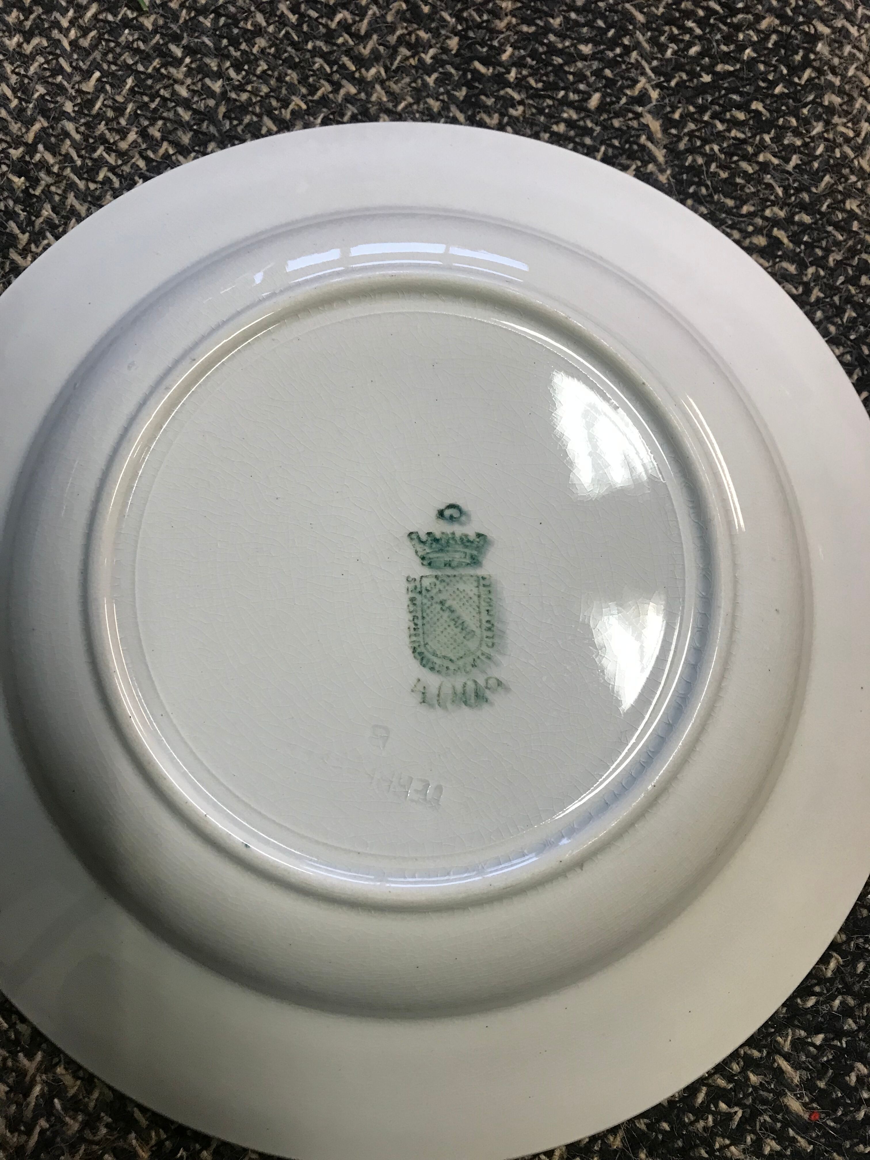 8 earthenware plates in St Amand earthenware with plant motif