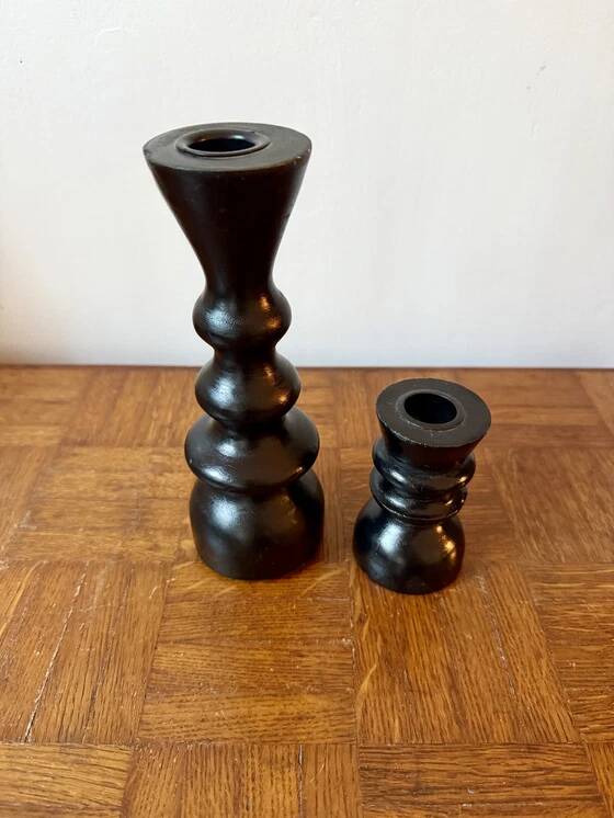 Pair of black turned wood candlesticks