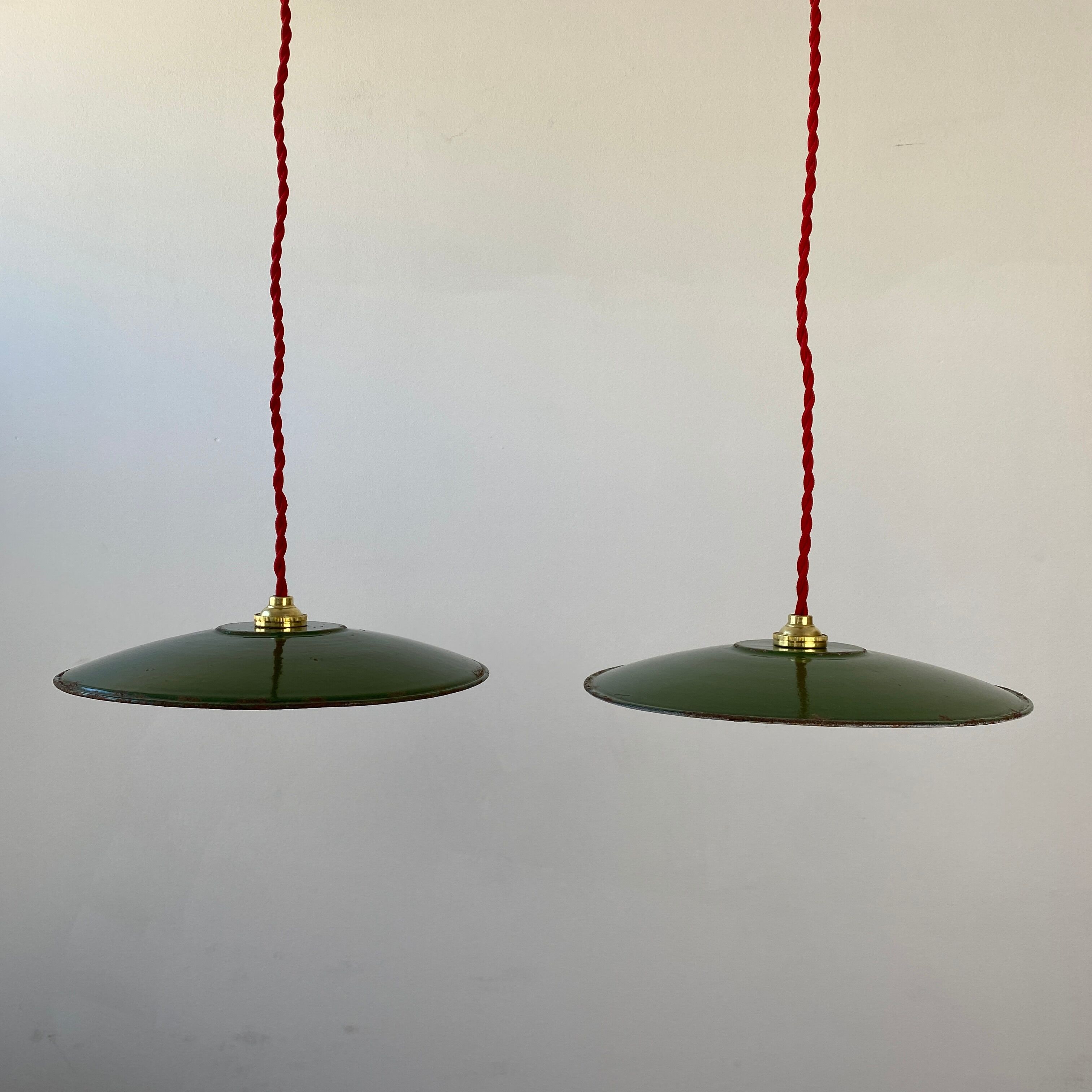 Pair of old green enamelled suspensions