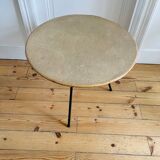 Tripod coffee table with a straw covering.