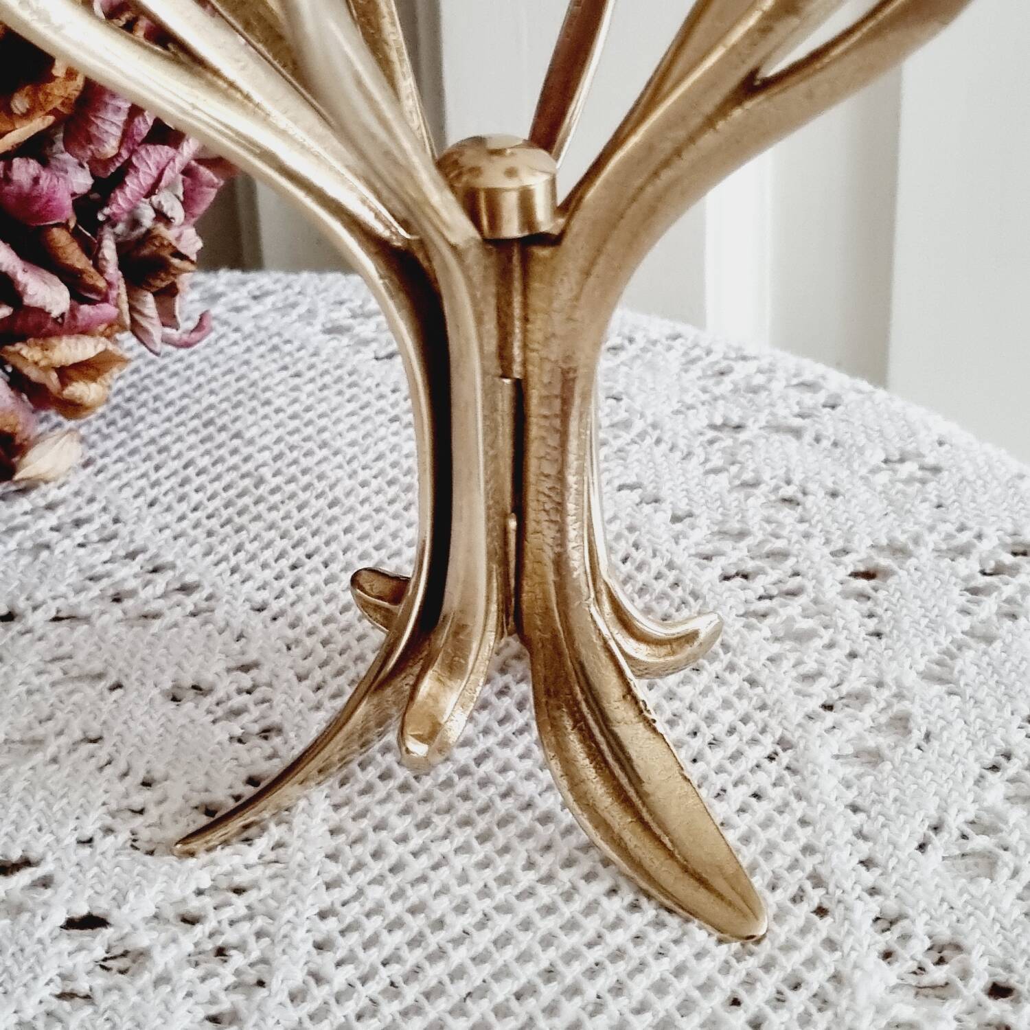 Tall brass flower candlestick