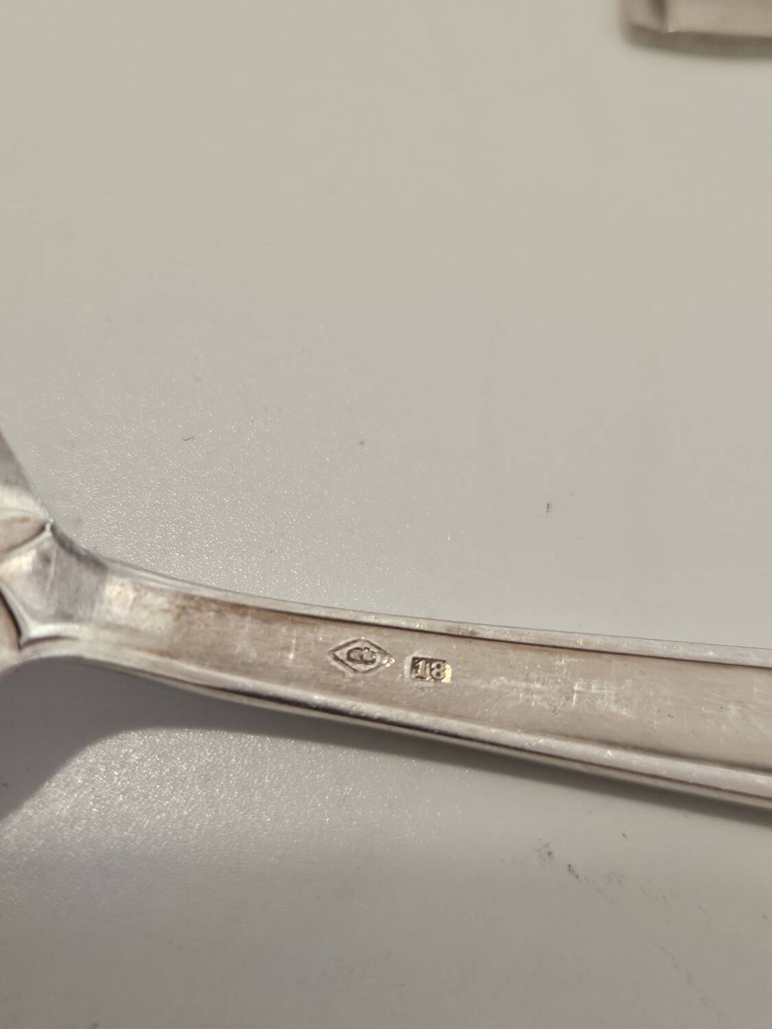 Set of silver dessert spoons and forks