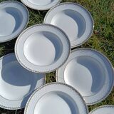 Twelve white porcelain plates