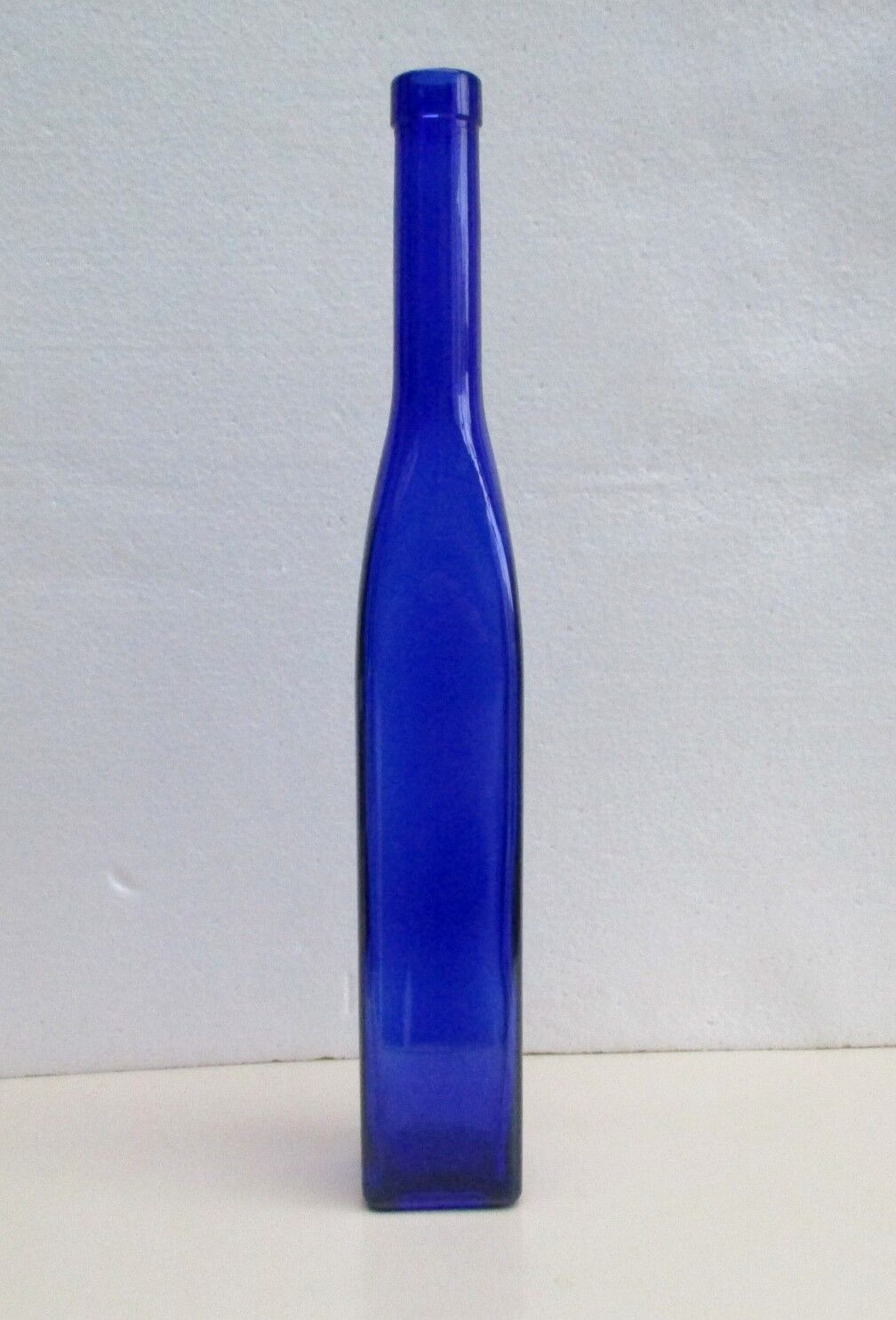Blue glass bottle, square