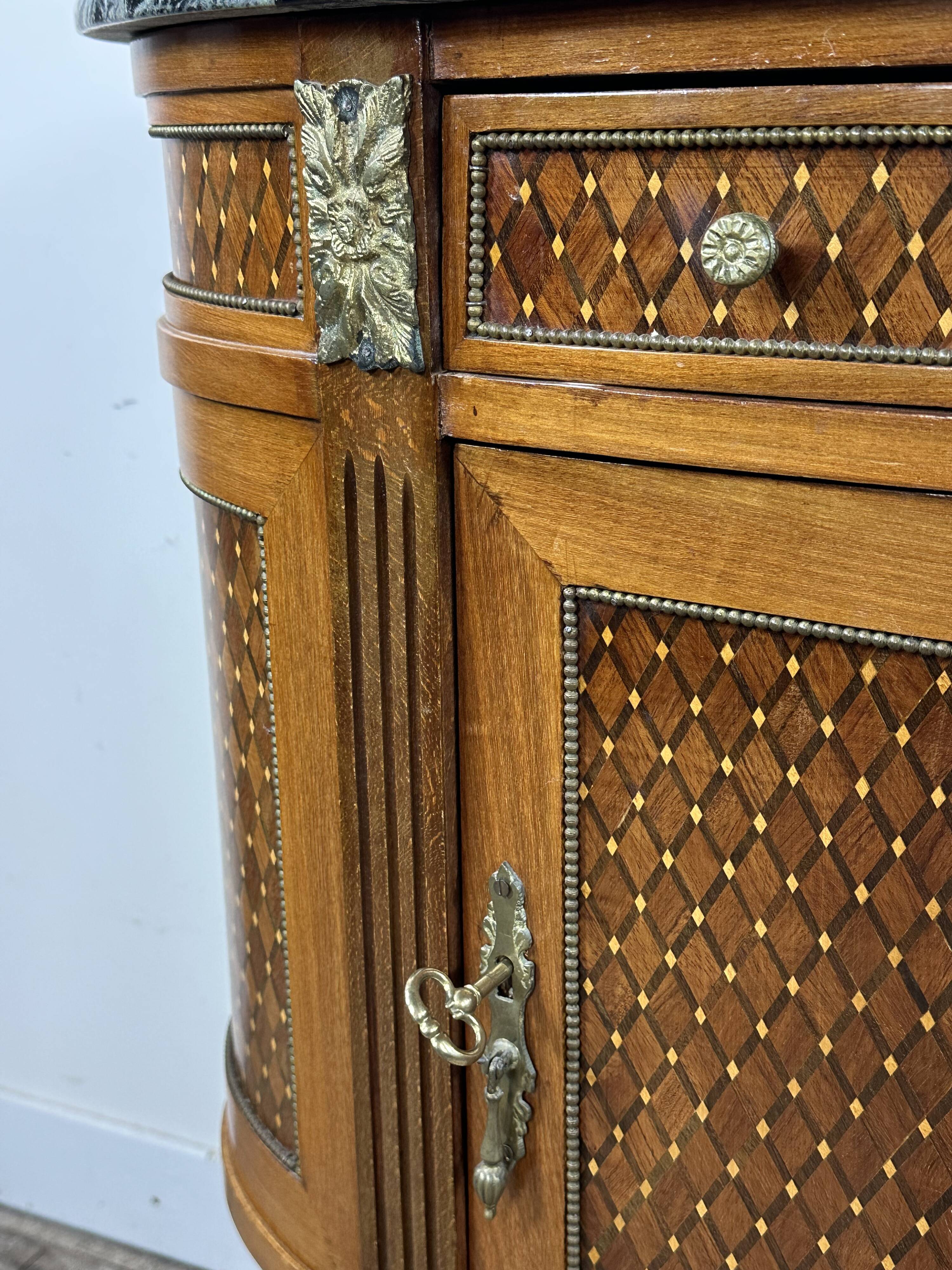 Half-moon commode in the Louis XVI style