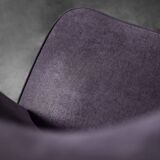 High-backed wing chair in oak and purple fabric, vintage Scandinavian style from the 1950s.