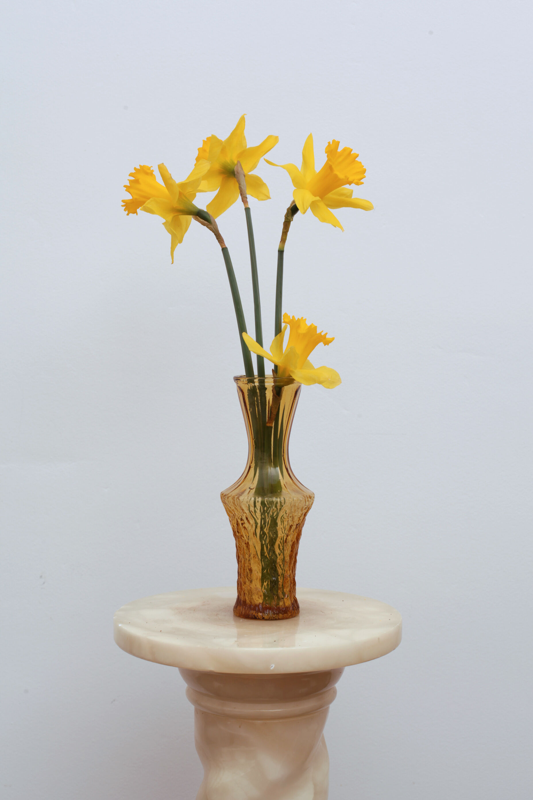 Yellow glass vase streaked and flared