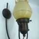 Decorative glass and metal wall light