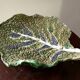 Vintage ceramic leaf-shaped vide poche, signed.