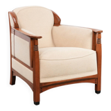 Art Nouveau design armchair with a luxurious light fabric upholstery