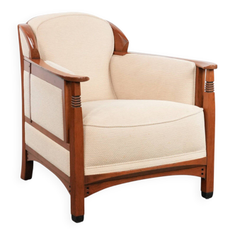 Art Nouveau design armchair with a luxurious light fabric upholstery