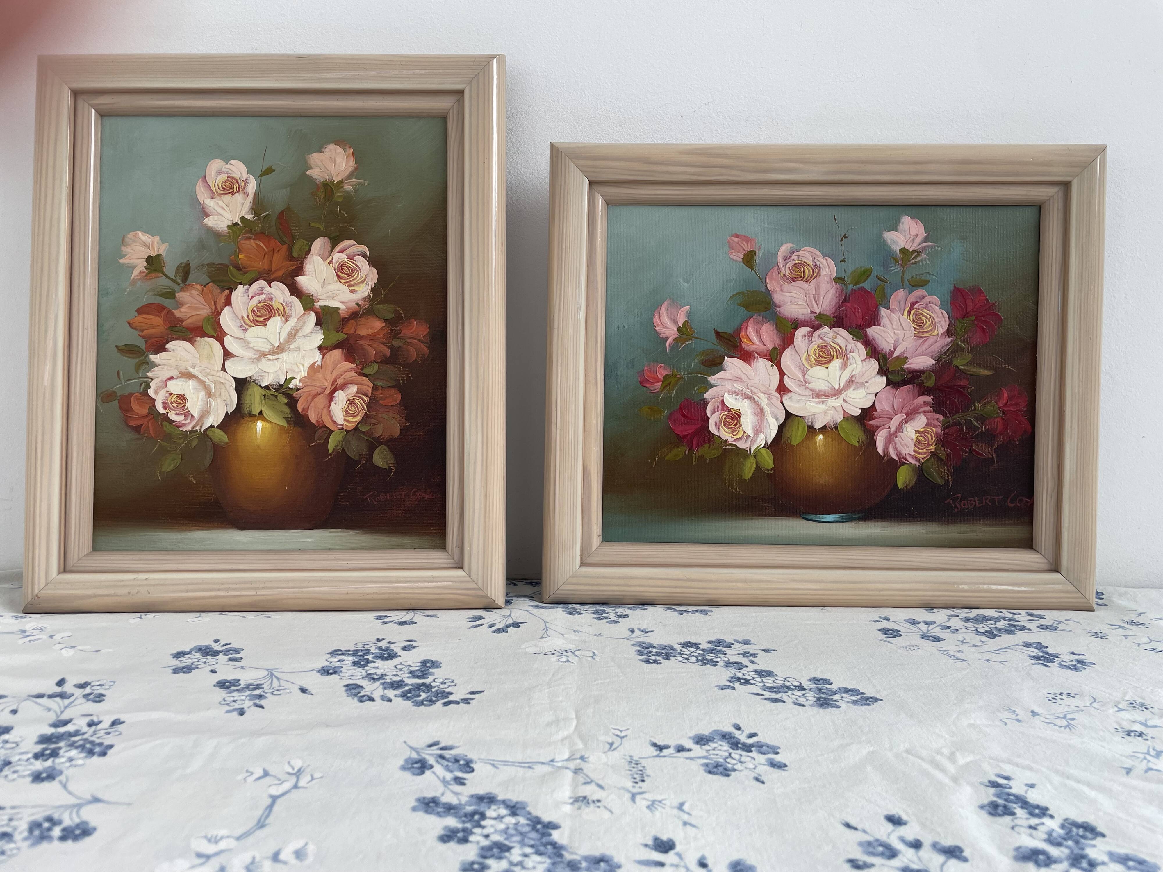 Pair of oils on canvas signed by Robert Cox, floral still lifes.