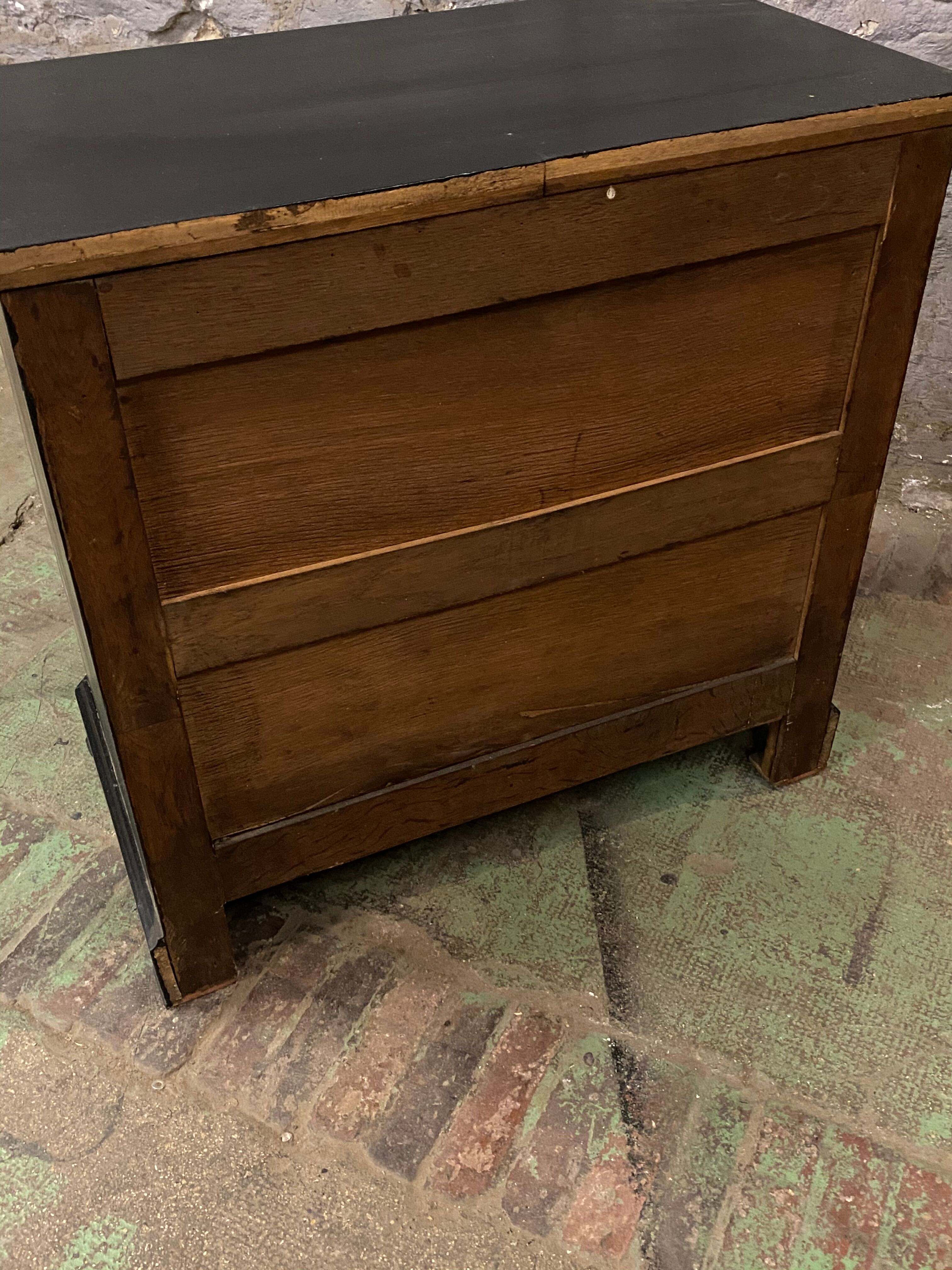 Old black patinated chest of drwers