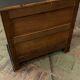 Old black patinated chest of drwers