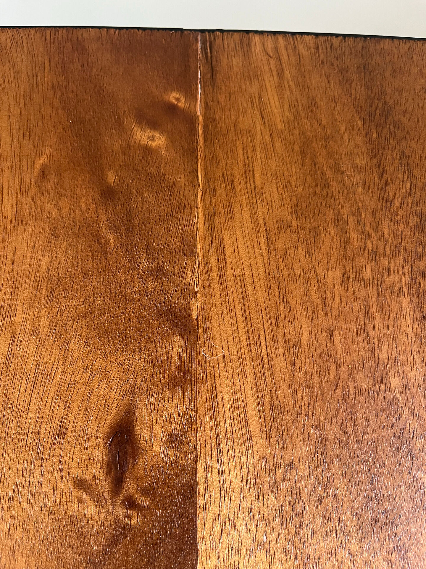 Mid-century coffee table with tapered legs.