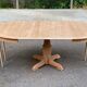 Large extendable round dining table stripped with a central wooden leg 110-198cm.