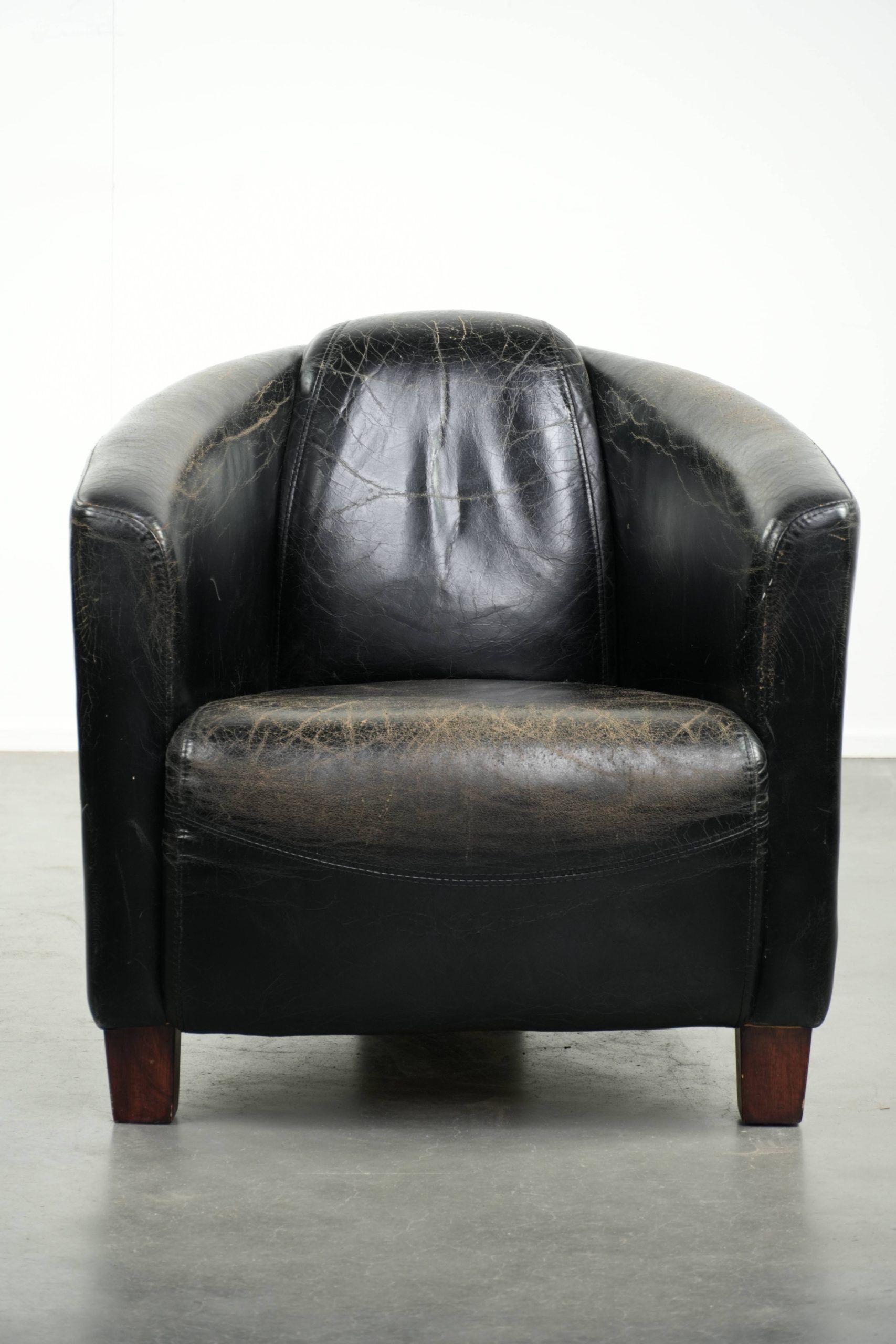 Black vintage cowhide aviator design armchair with characterful appearance