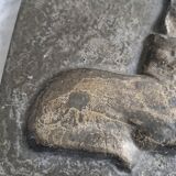 Bas-relief plaque of a rabbit in brown patina, seated cat