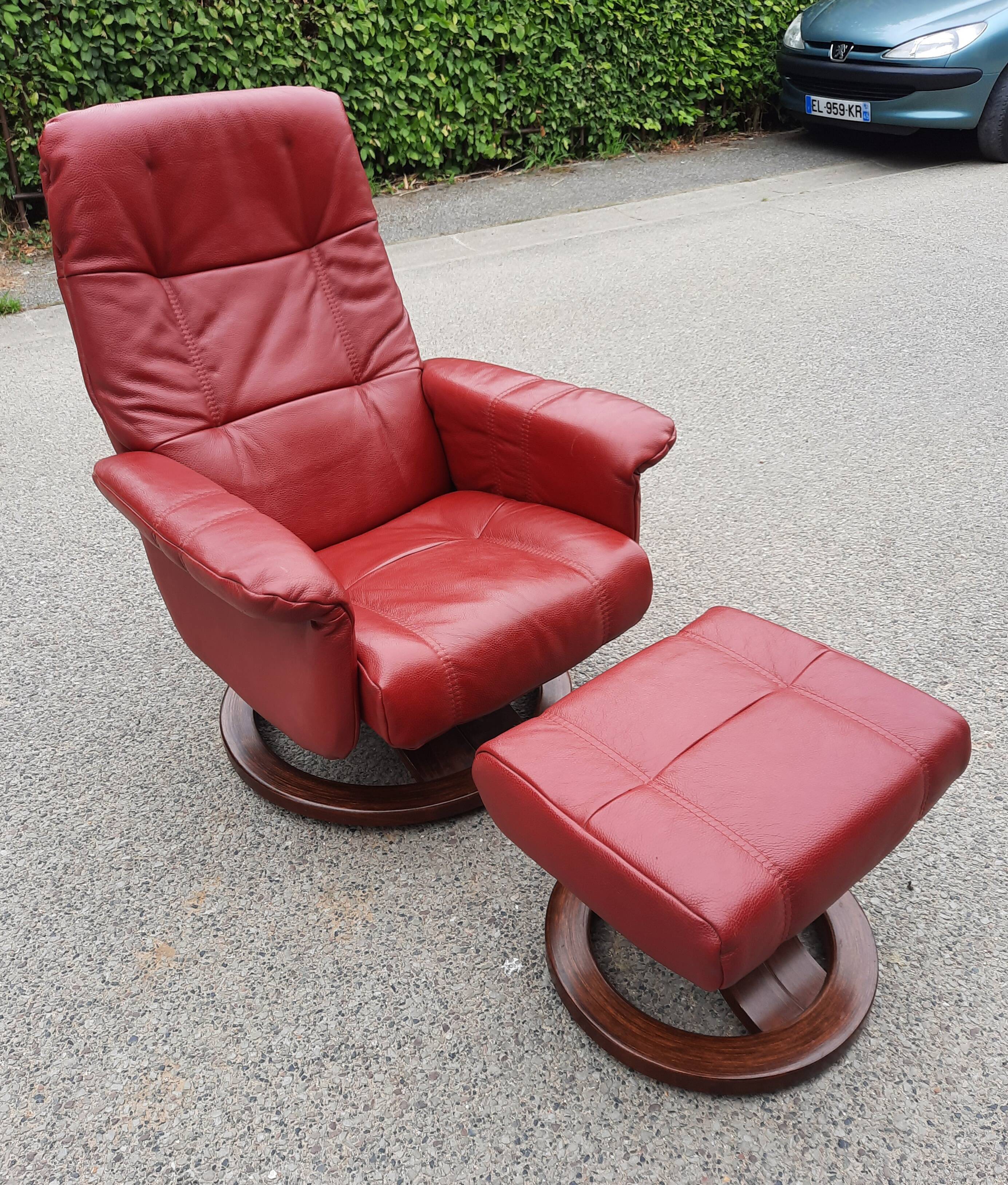 Red leather relax armchair and pouf