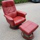 Red leather relax armchair and pouf