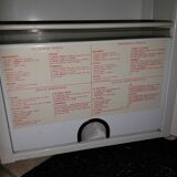 White lacquered metal medicine cabinet