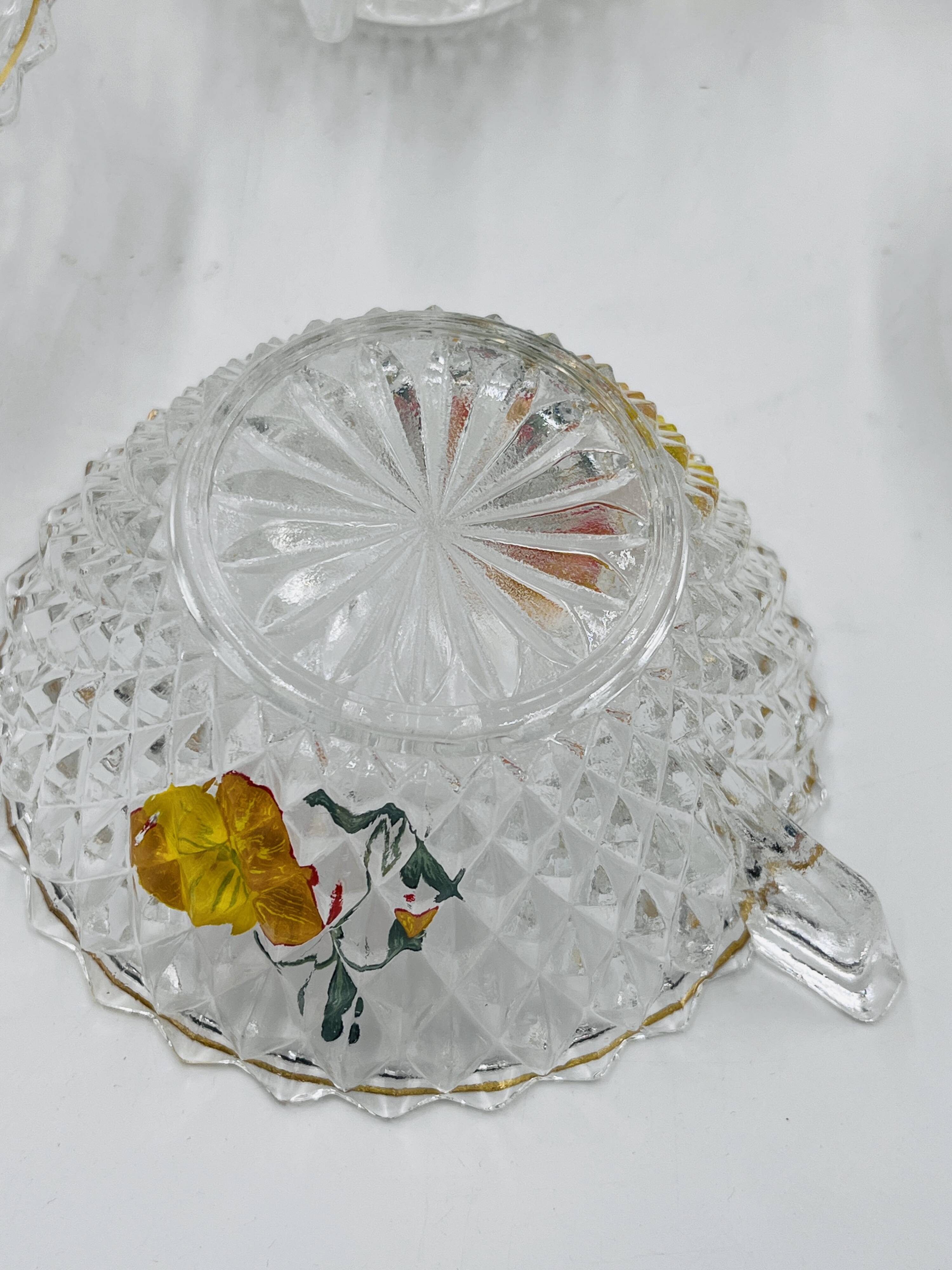 Vintage glass fruit salad serving set with a pansy design.