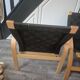 pair set of 2 armchairs with a wooden frame and black fabric weaving